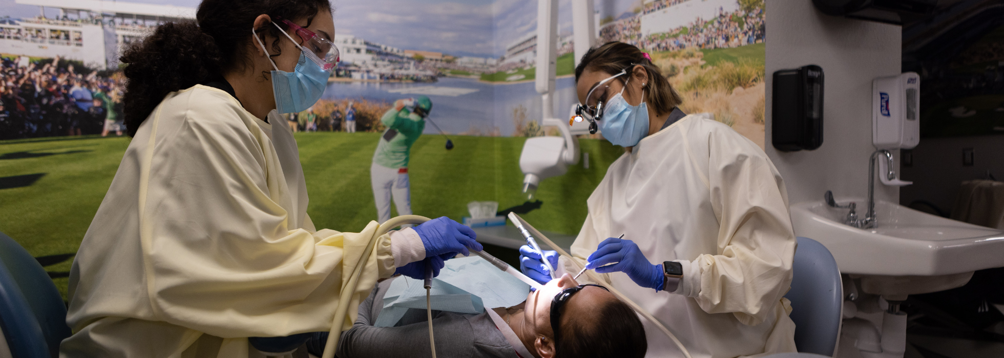 two dentists working on a patients