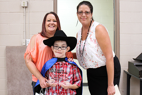 Sarah Dorcey-Garcia, Austin and Jamie Bethune pose for a photo during SVdP's Volunteer Appreciation Luncheon.