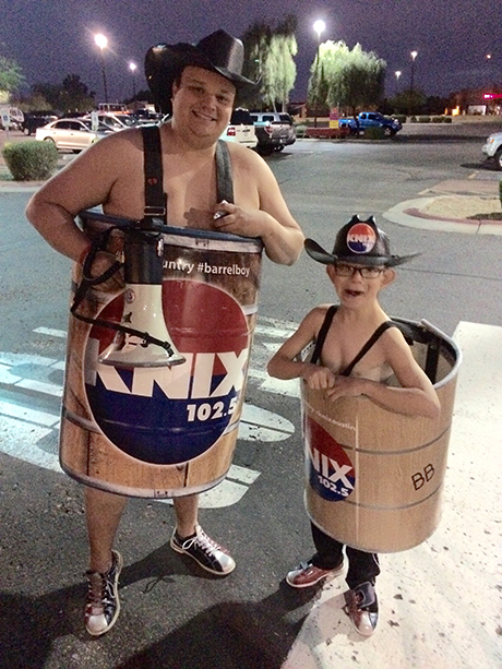 Austin dressed up as Barrel Buddy and posing for a photo for KNIX's Barrel Boy