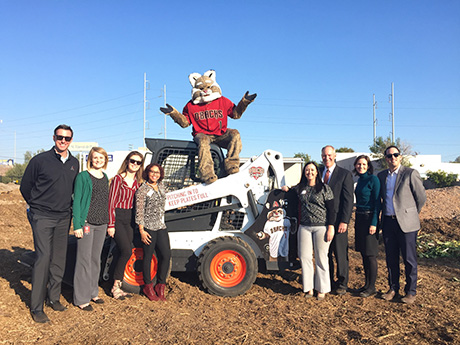 Arizona Diamondbacks staff and mascot Baxter the Bobcat pose for a photo during the groundbreaking event.