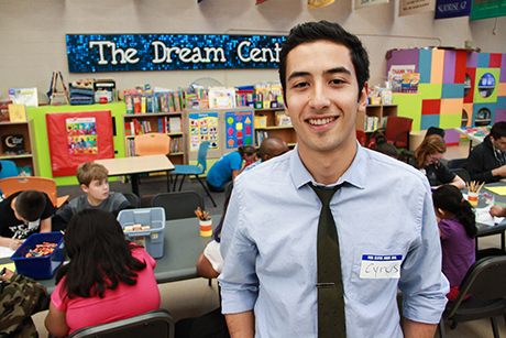 Volunteer Cyrus Etebari poses for a photo in the Dream Center.