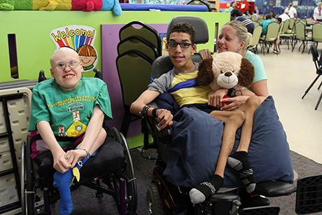 Christina, David and Krissy pose for a photo in SVdP's dining room.