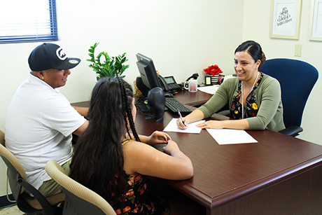 Elva Hooker, FWP clinical manager and RD, consults with patients in her office at SVdP.