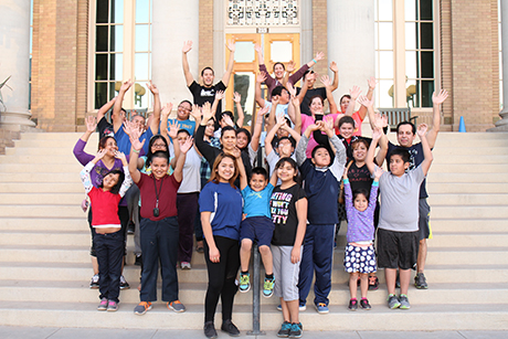 Families pose for a group photo during a Family Wellness Program nutrition class.