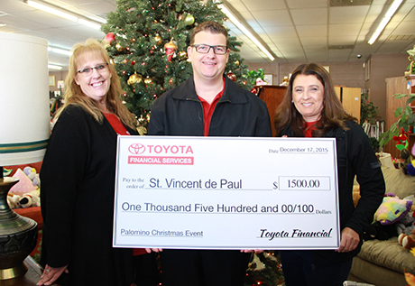 Toyota Financial Services presents check at Palomino Christmas Event