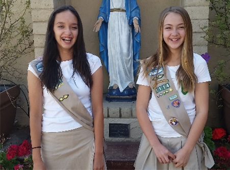 Jacey and Cienna pose for a photo at Our Lady of Mount Carmel