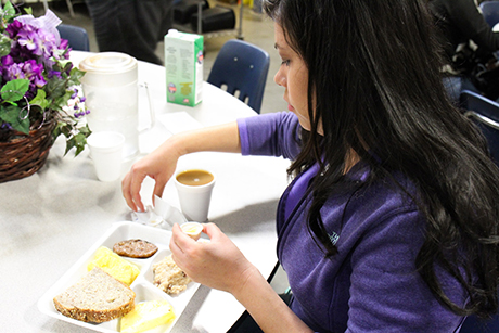 Jasmine eats breakfast in SVdP's downtown dining room.