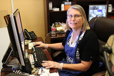 Encore Fellow Josie works on Craigslist ads to resell valuable donations at the Mesa Thrift Store.