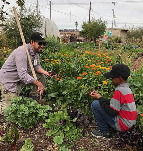 Sahar and Tony work in the Urban Farm together.