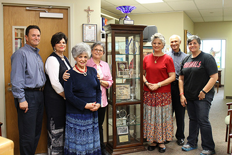 Serrano family posing for a photo in their corporate office.