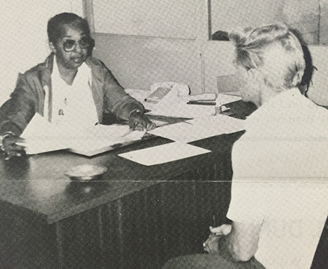 SVdP volunteer in Travelier's Aid helps a client in 1984.