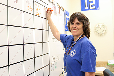 Theresa writes down the number of meals served during lunch in SVdP's downtown Phoenix dining room.