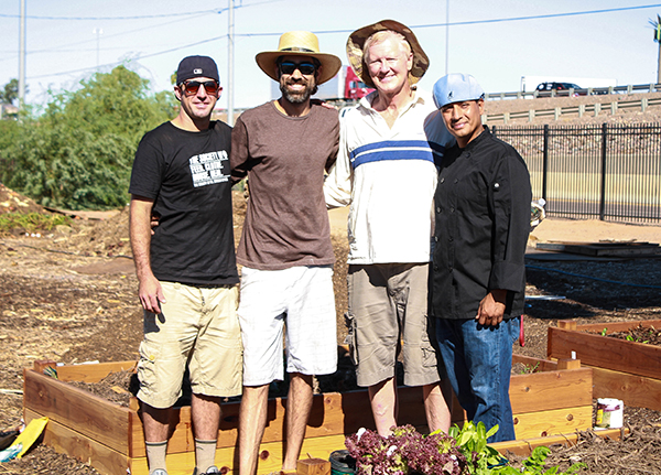 Phoenix food truck owners pose for photo with SVdP Urban Farm staff.