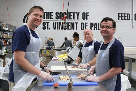 Volunteers prep food in SVdP's main kitchen.