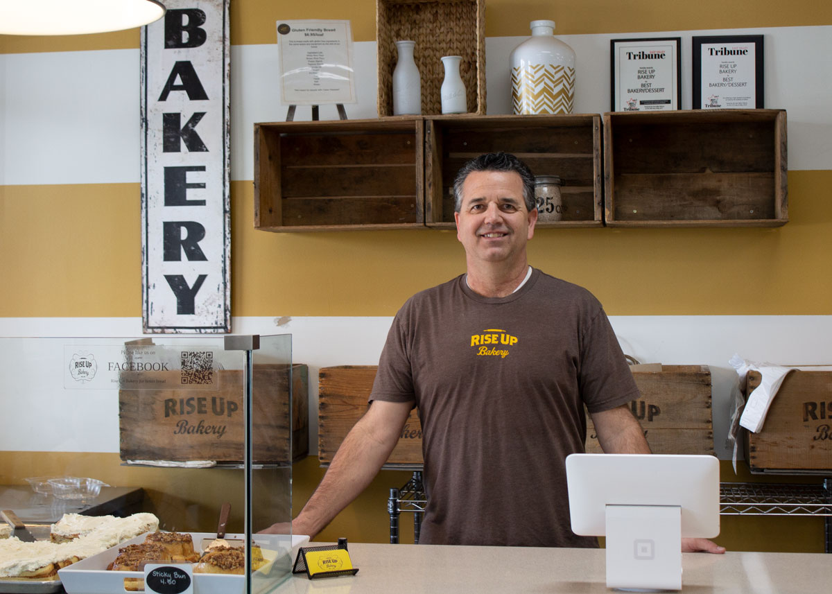 Jay Lunt, owner and operator of Rise Up Bakery, at his shop's counter