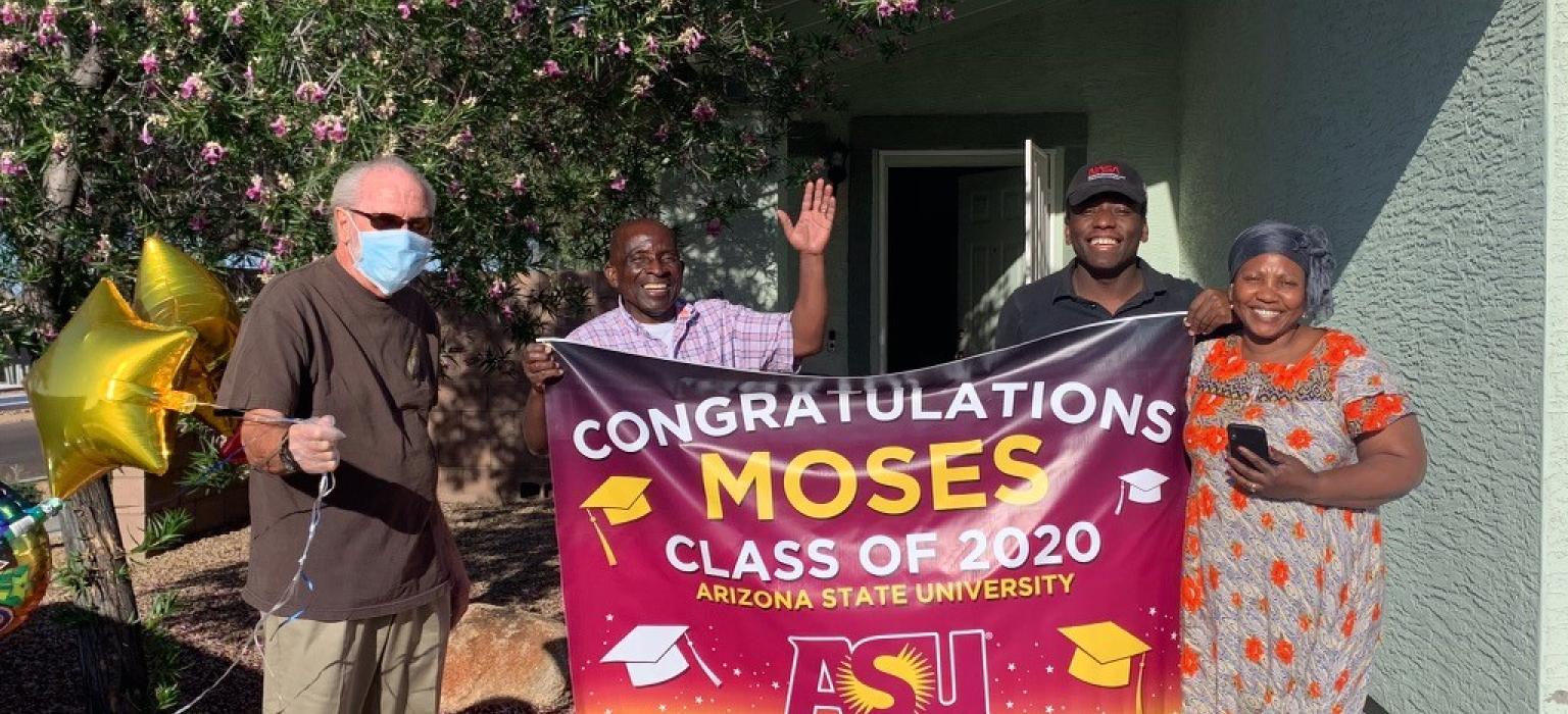 College Scholarship and Internships Header Four people standing with a large sign congratulating a recent graduate