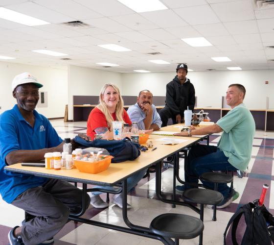 Group of people sitting around a table