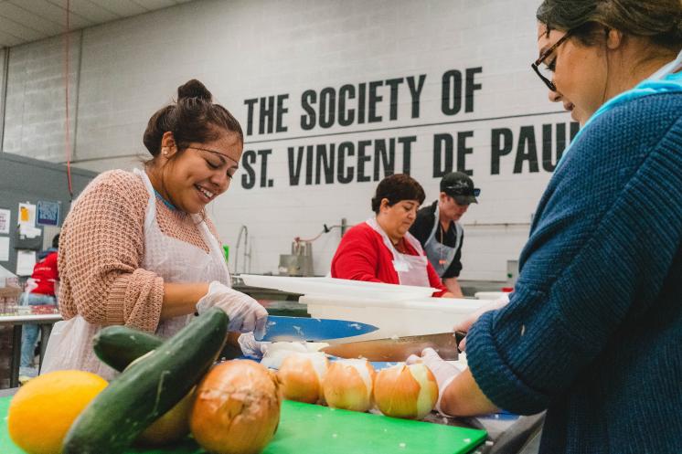 Kitchen VSO Header Two women smiling and chopping vegetables