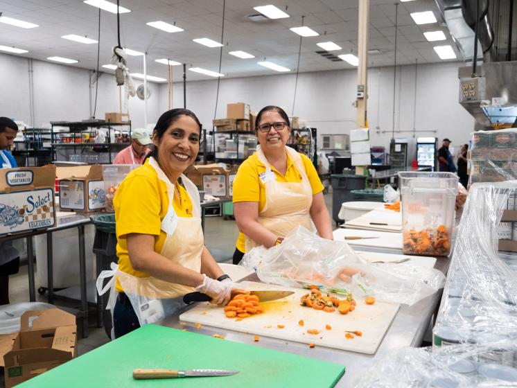 volunteers chopping vegetables