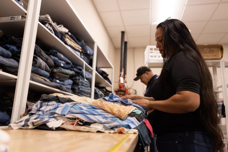 Volunteer Sorting Clothing Volunteer sorting clothing