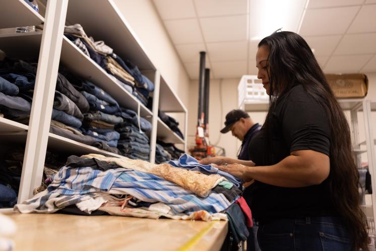 Volunteer sorting clothing