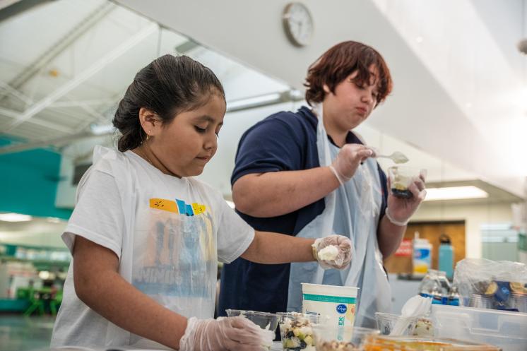 Two kids participate in a Family Wellness workshop