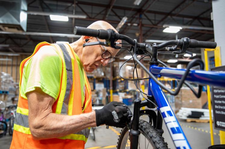 guy fixing a bike