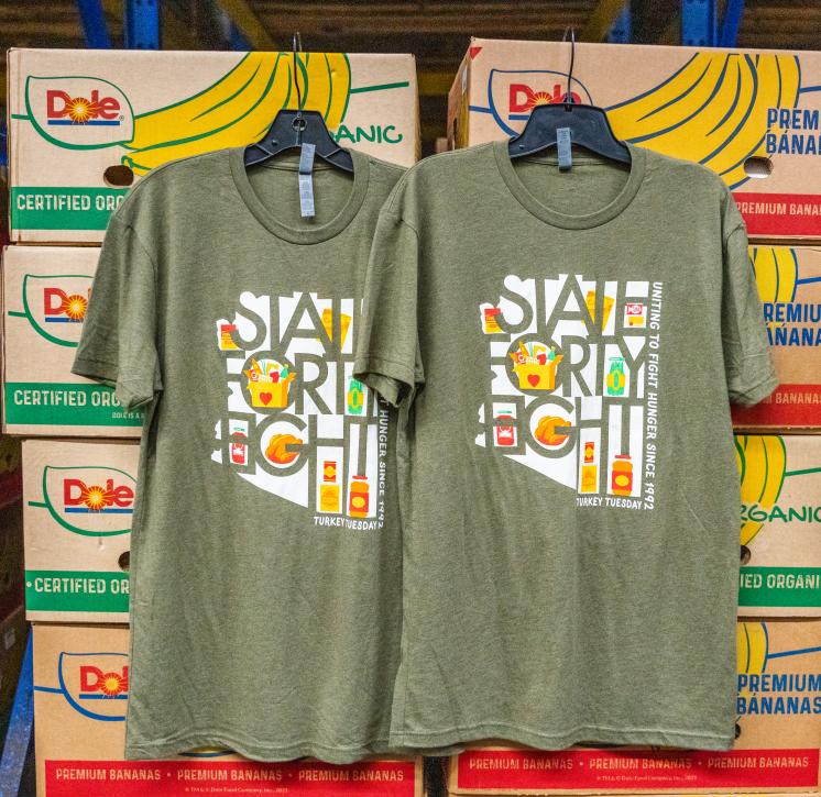 state48-tt-shirts Two State48 shirts hanging up in St. Vincent de Paul warehouse