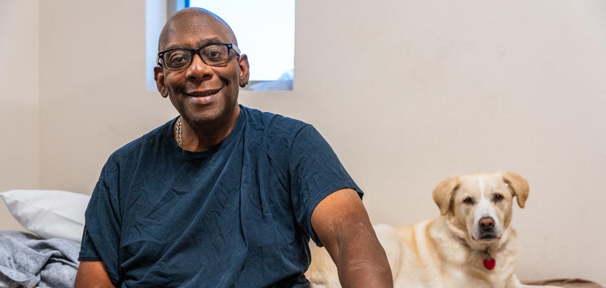 John and Kimba sit in their Oz dorm.