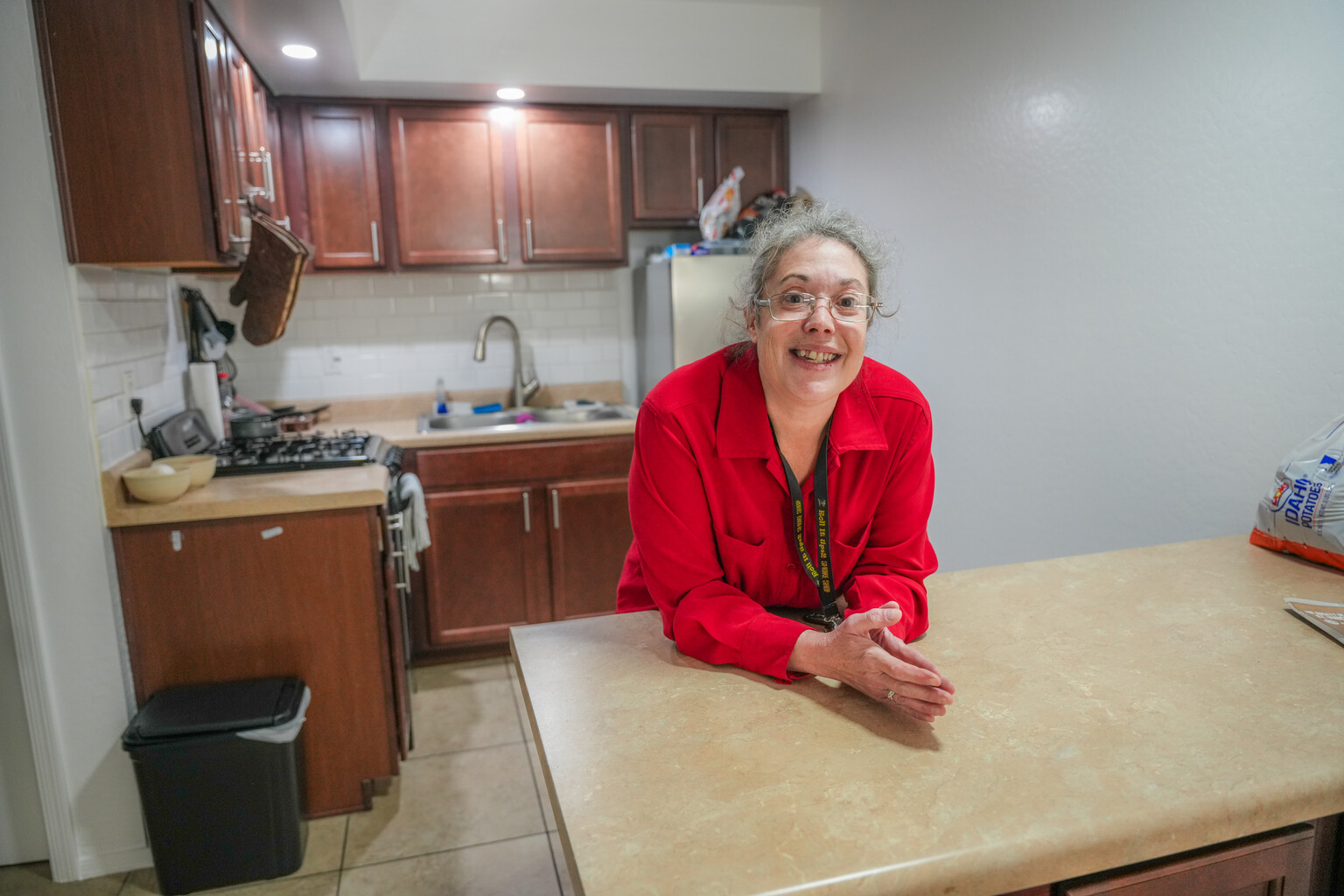 Carmela poses in her new apartment.