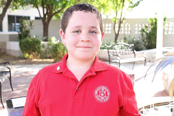 Adrien poses for a photo at SVdP's main campus.