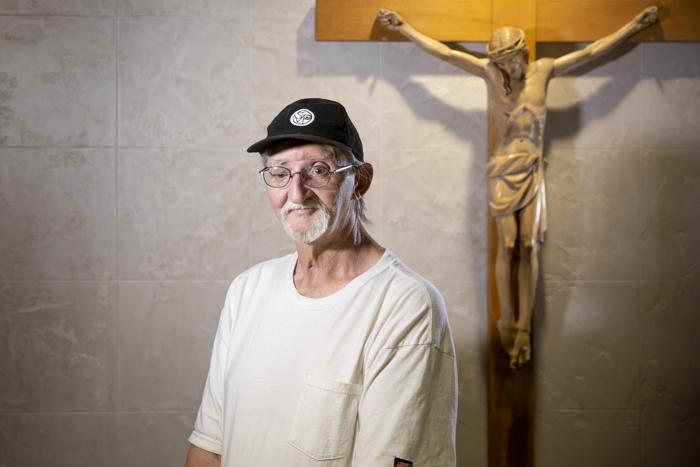 John Apperson stands in the small chapel at Ozanam Manor, St. Vincent de Paul's shelter.