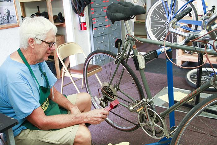 Volunteer David Hicks repairs a bike at SVdP.