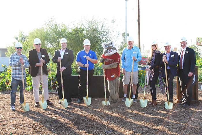 Local partners and supporters pose for a groundbreaking photo in SVdP's Urban Farm.