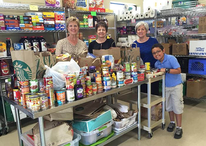 Kegan brings drops off donated food to nearby St. Vincent de Paul food pantry.