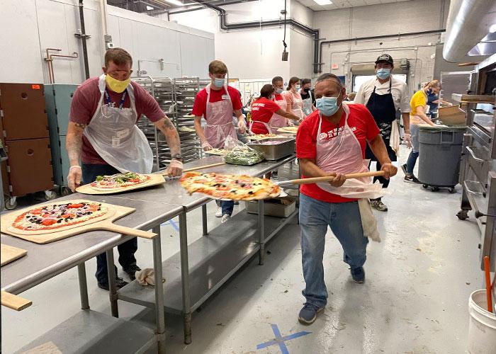 Friday Night Pizza returns to SVdP for the first time since the COVID-19 pandemic began.