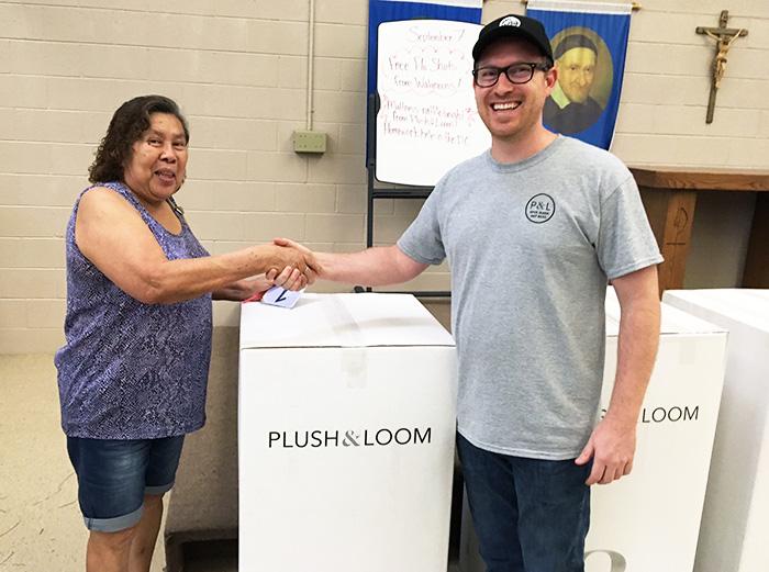 Plush & Loom President Caleb Porter gives free mattress to Family Dining Room guest.