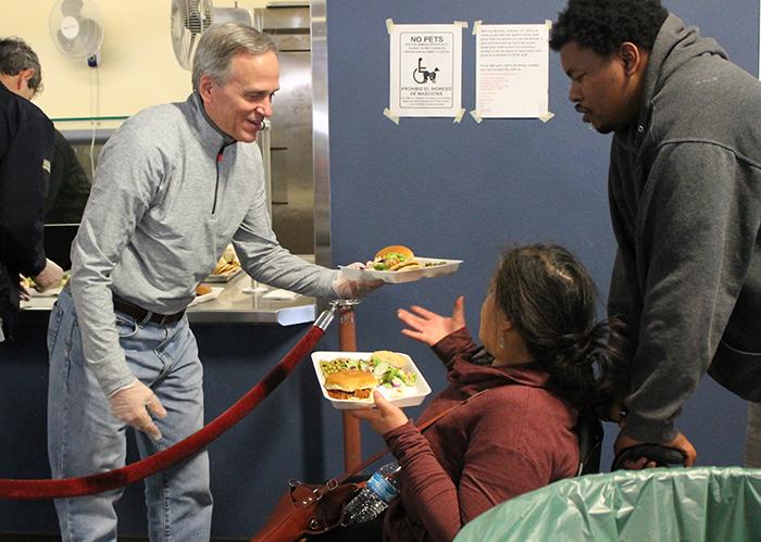 Notre Dame President Fr. John Jenkins serves meals in PDR