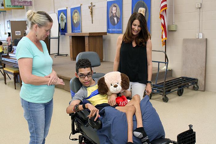 David drives his new wheelchair in SVdP's Family Dining Room.