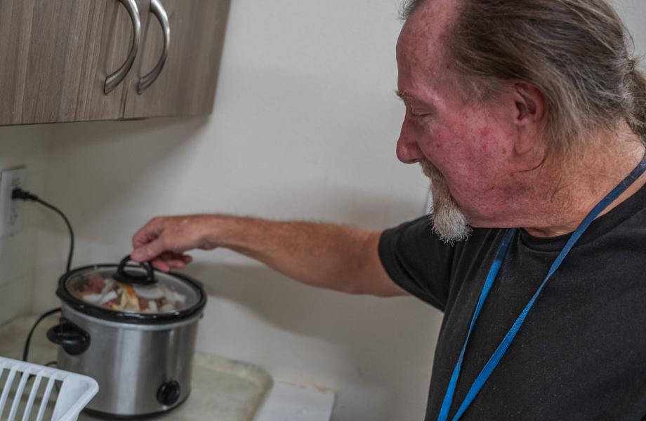 Greg prepares a slow cooker.