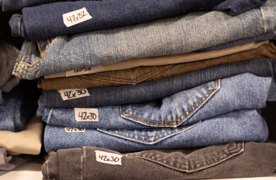 jeans stacked on a shelf