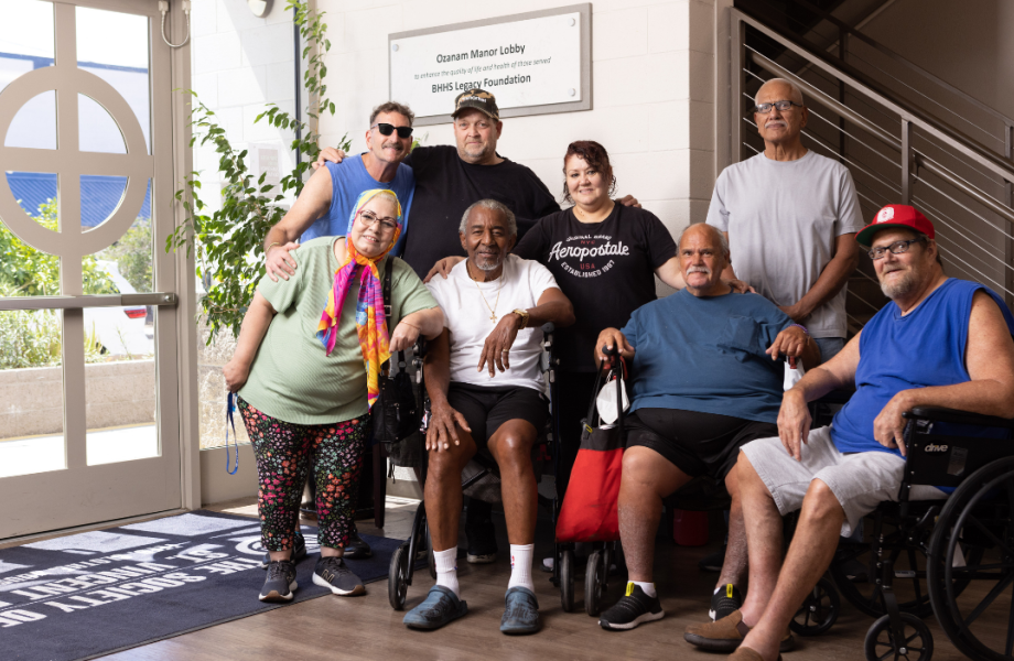 Group of Ozanam Manor residents posing together in the lobby