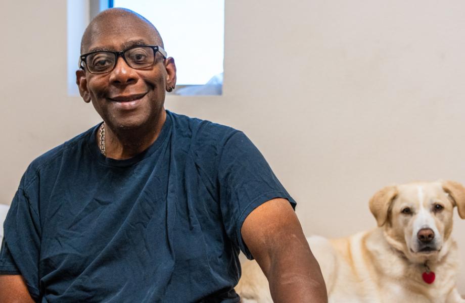 John and Kimba sit in their Oz dorm.