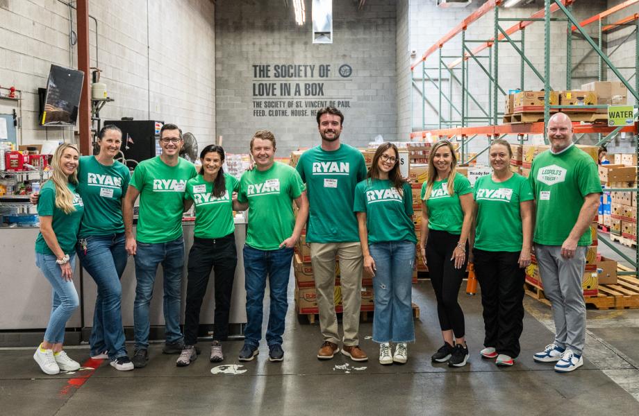 Ryan Companies staff poses in SVdP's Food Reclamation Center.