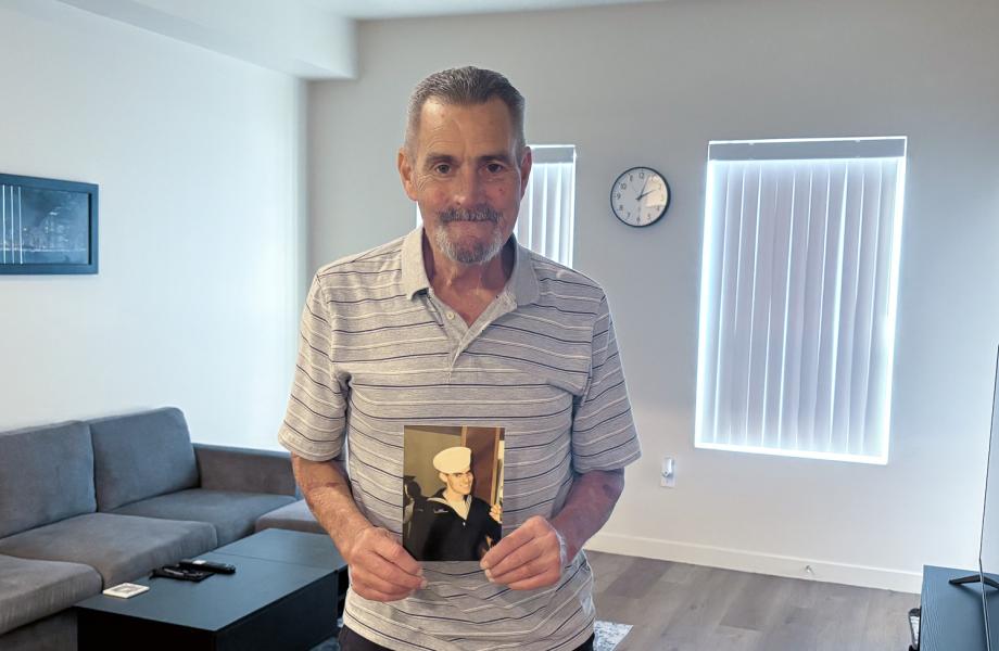 Michael Osborn stands in his new home.