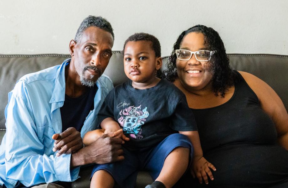 Marc and Caprise pose with their son, Pharaoh in between them.