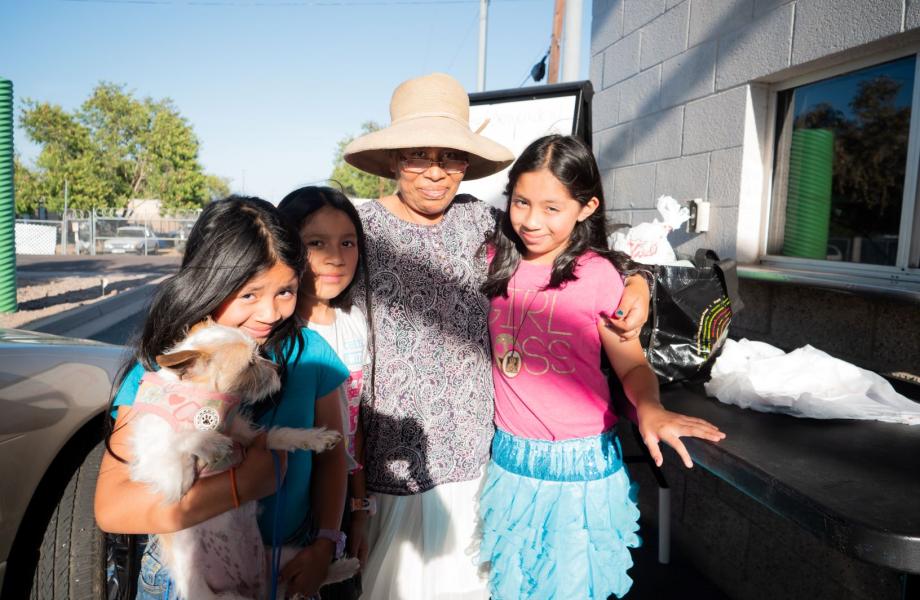 Lucia and her daughters at the SVdP drive-thru out of which the Family Dining Room and Dream Center operate.