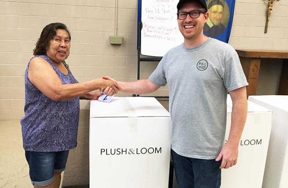 Plush & Loom President Caleb Porter gives free mattress to Family Dining Room guest.