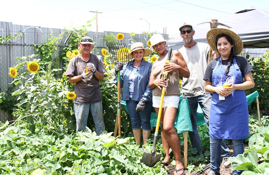 Volunteers pose for a photo at the Mesa Dining Room urban farm.