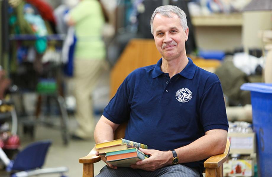 Scott Timmons poses for a photo in SVdP's Thunderbird Thrift Store.